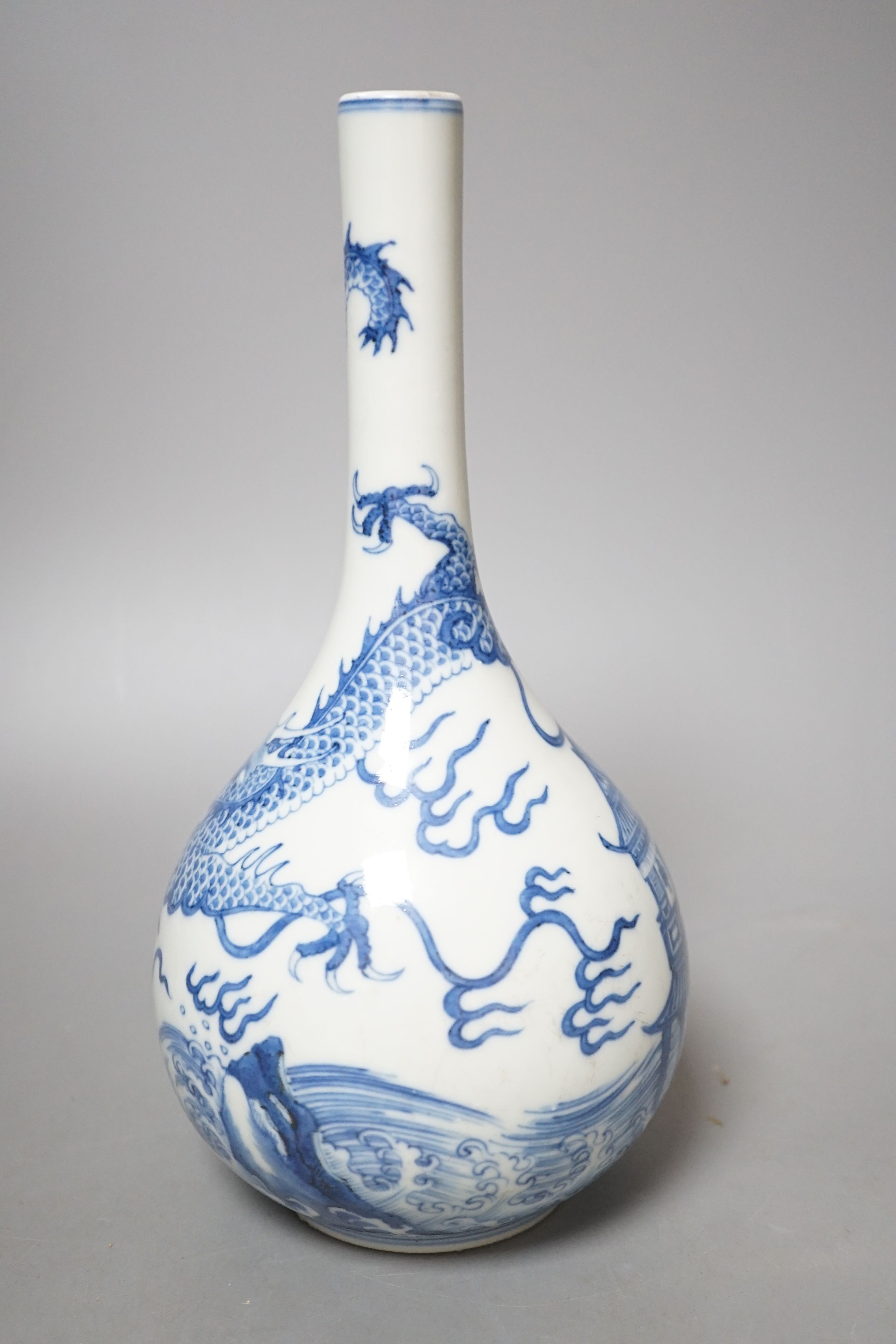 A Chinese blue and white ‘dragon’ bottle vase, 25cm